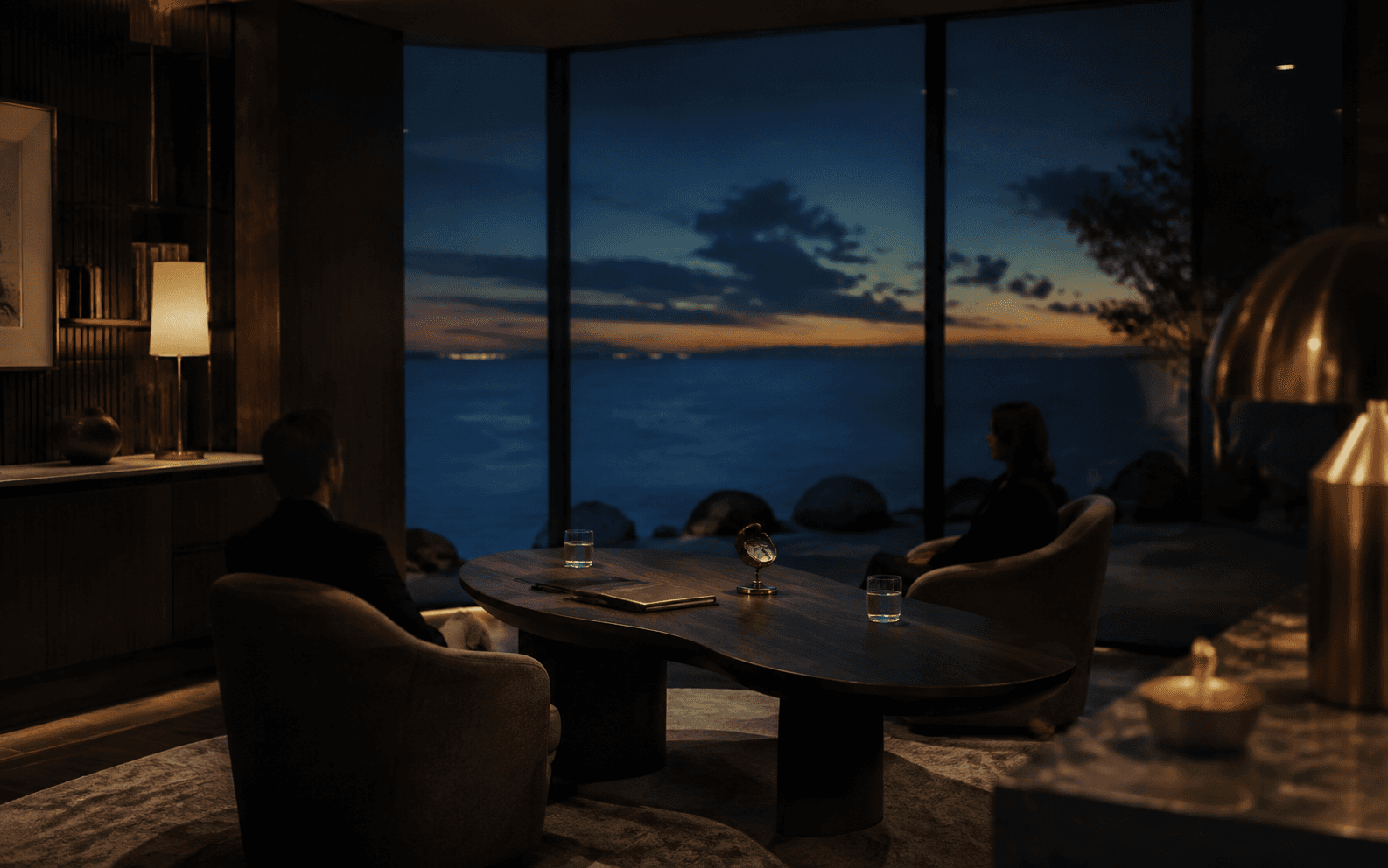 A private client conversation in a calm coastal office at twilight
